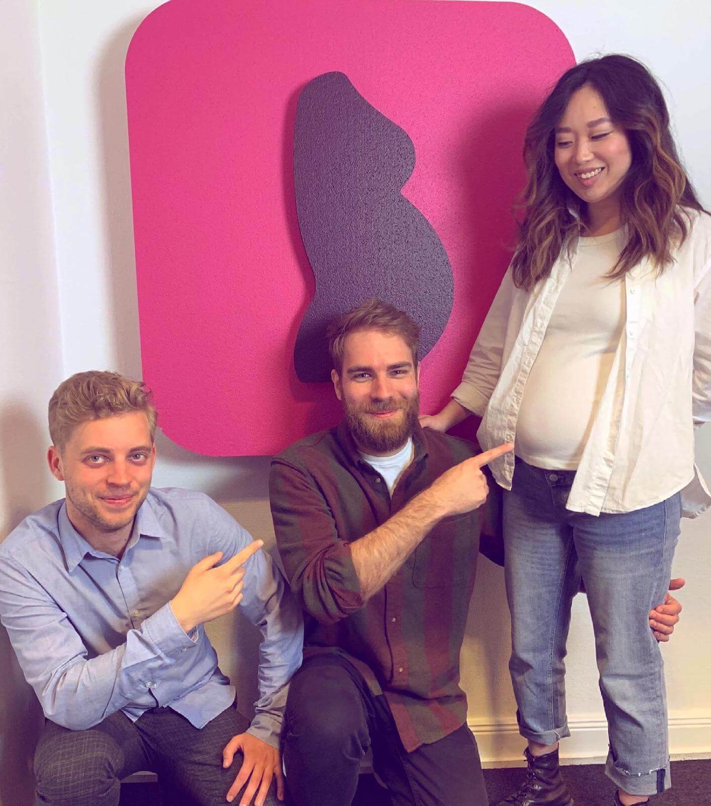 The team of Preglife Connect pointing to the baby in the belly
